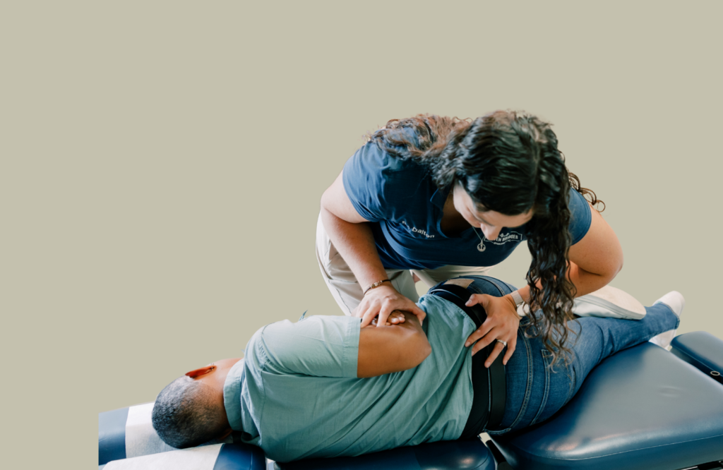 Dr Dalton adjusting a patients low back in side posture