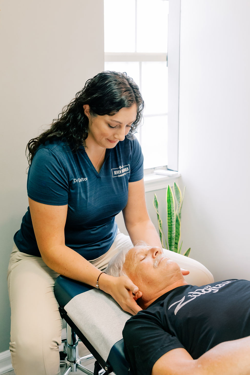 Man getting neck adjustment with muscle release therapy at Seven Bridges Chiropractic located in Jacksonville, FL