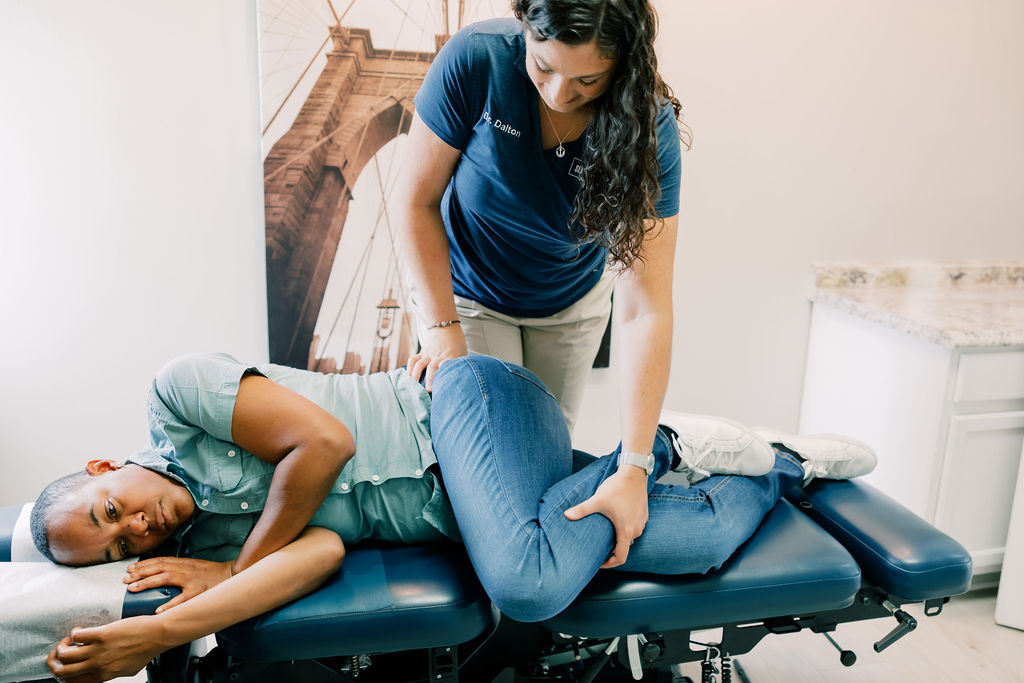 Dr. Dalton providing chiropractic care to patient at Seven Bridges Chiropractic