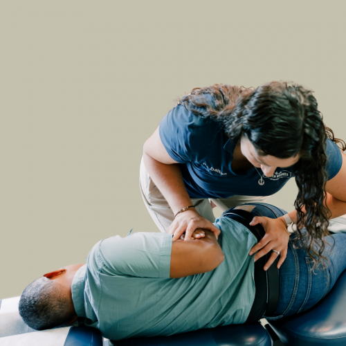 Dr Dalton adjusting a patients low back in side posture