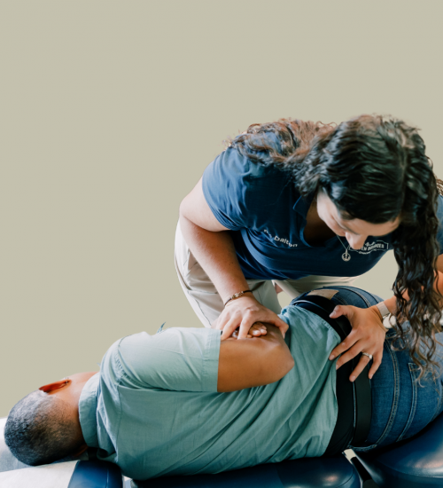 Dr Dalton adjusting a patients low back in side posture