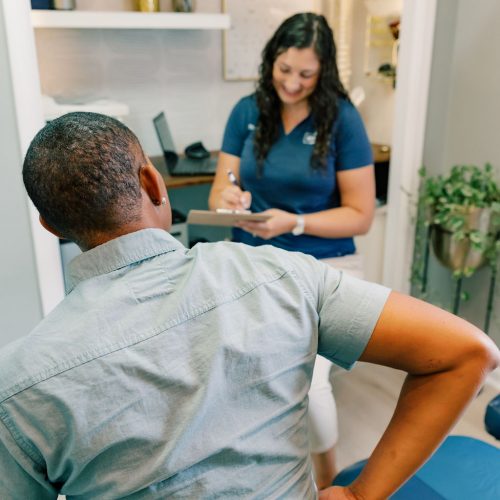 Dr Dalton doing a chiropractic evaluation at Seven Bridges Chiropractic in Jacksonville, FL