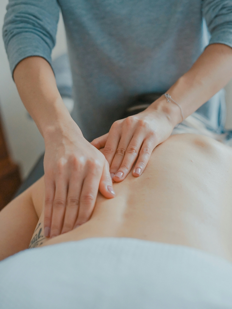 close up on hands massaging back